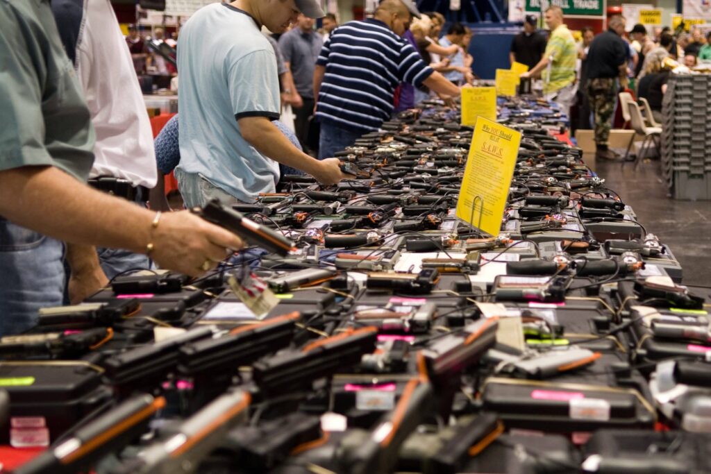 Table of guns at a gun show