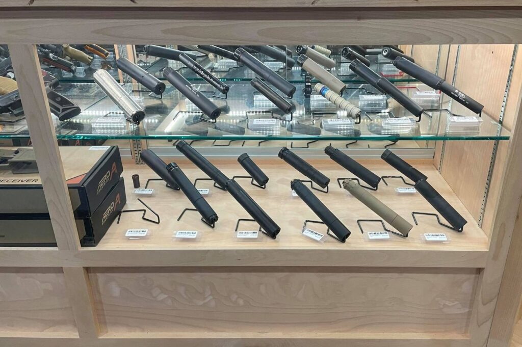 Glass case full of firearm suppressors