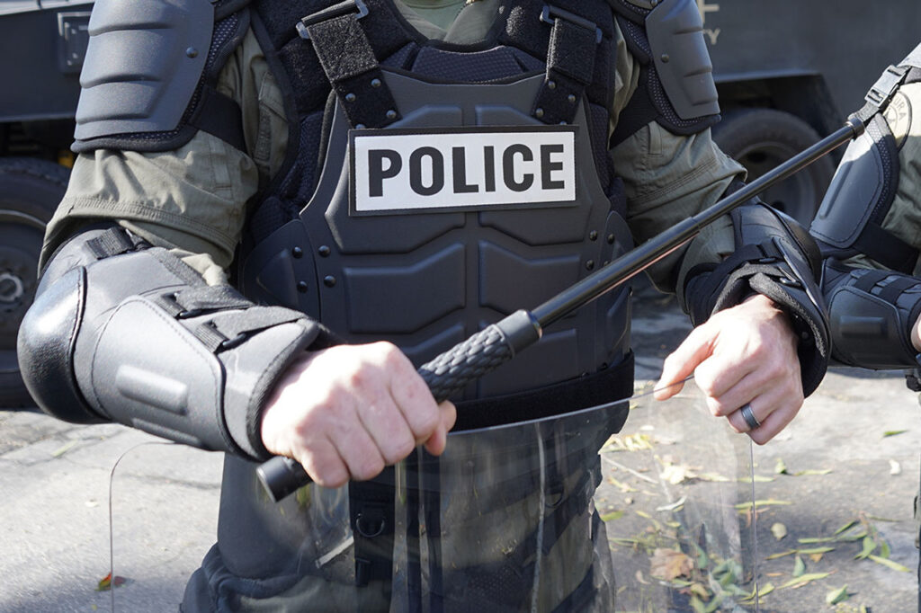 Police officer with expandable baton