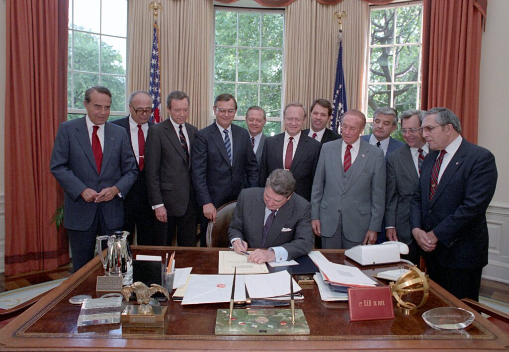 President Reagan signing the FOPA in the Oval Office.