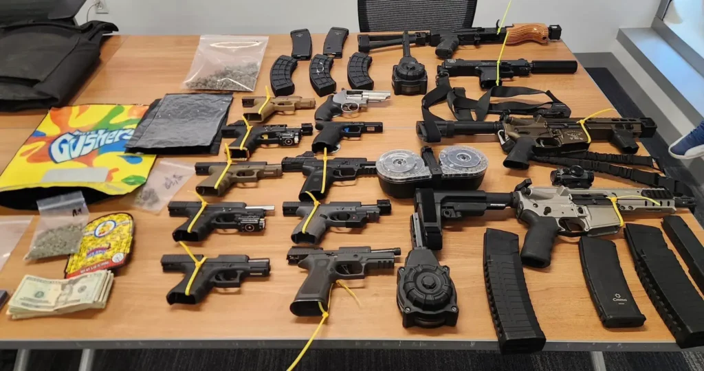 Illegal guns laying on table